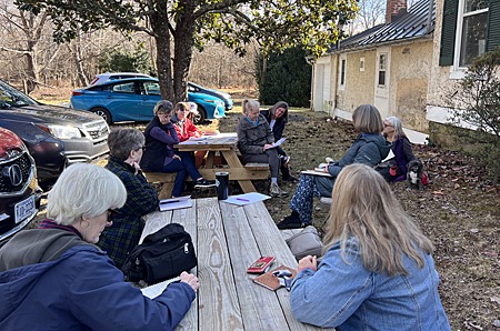 Workshop participants at picnic tables